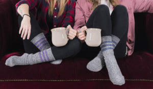 Two women wearing wool socks.